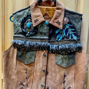 One of a kind hand made leather vest decked with Santa Fe style design.